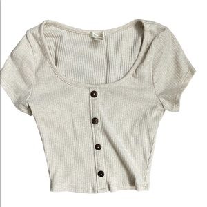 Cream color cute crop top
Buttons do not open its a pullover 
Worn once